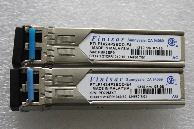 Small rectangular fiber optic transceiver module with gold edge connector and side bail latch