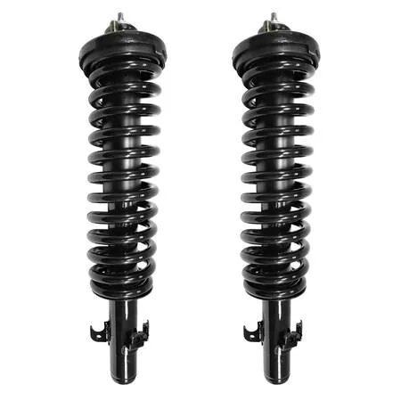 Two silver front strut assemblies with coil springs and top mounts on a plain background