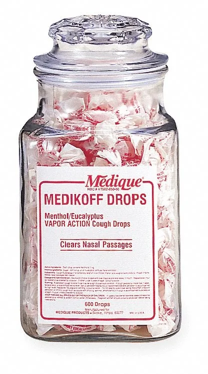 A clear jar holding 600 individually wrapped cherry menthol cough drops