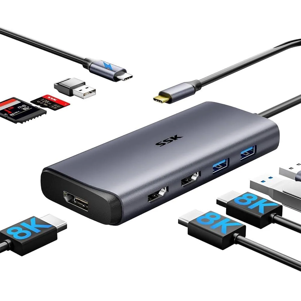 A small rectangular silver SSD and a flat dark grey docking station with multiple ports side by side