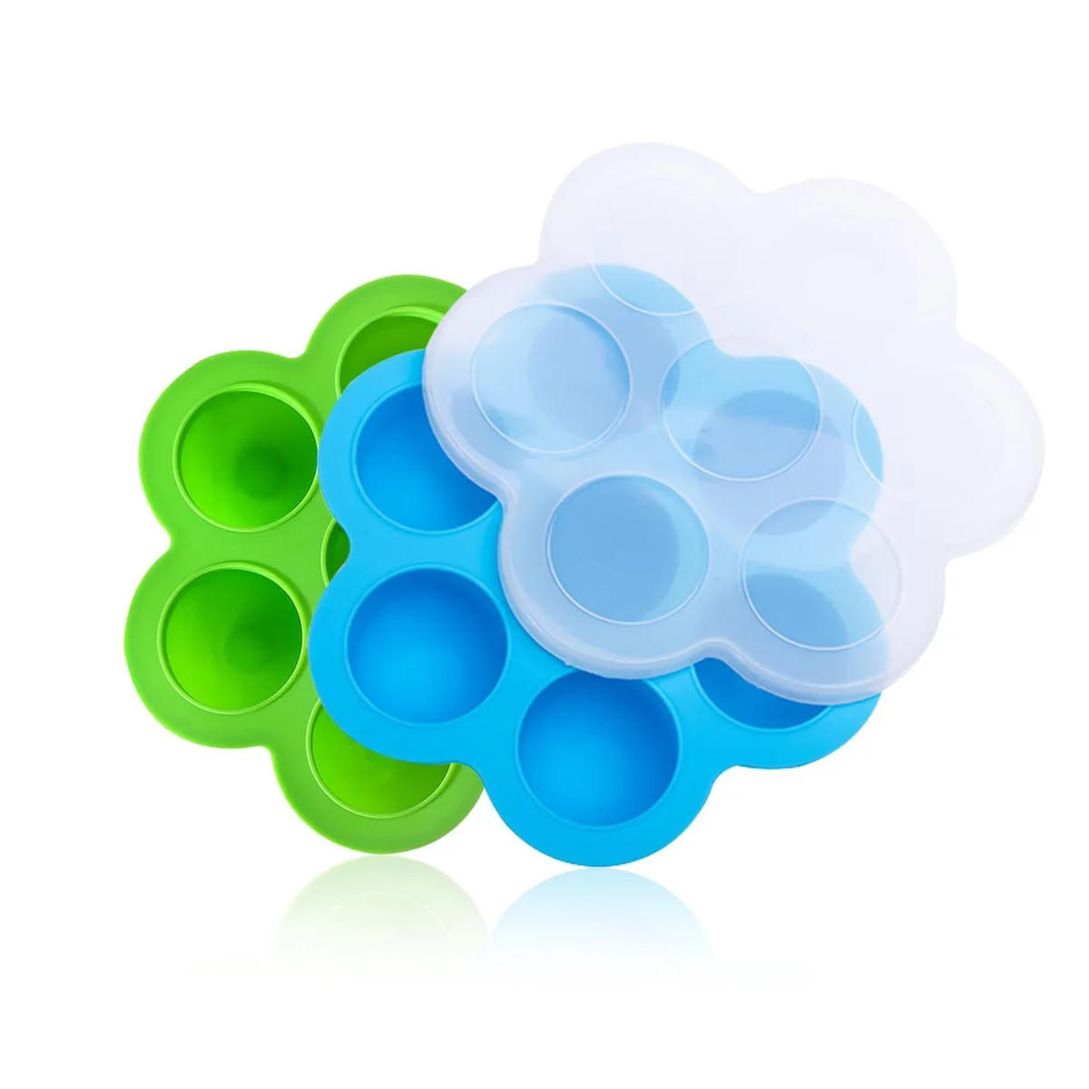 Two rectangular silicone egg bite molds, one green one blue, each with seven round cavities and a lid