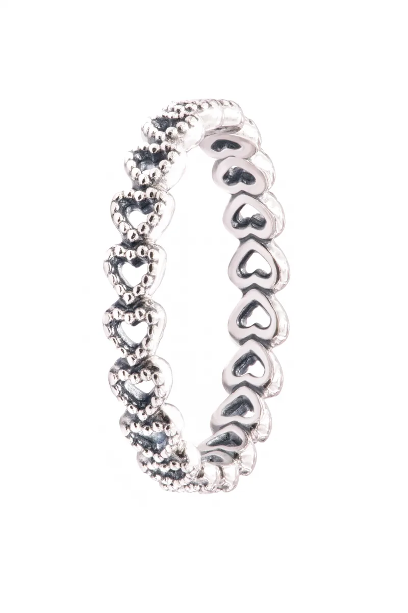 Sterling silver ring with linked heart motifs and beaded detailing
