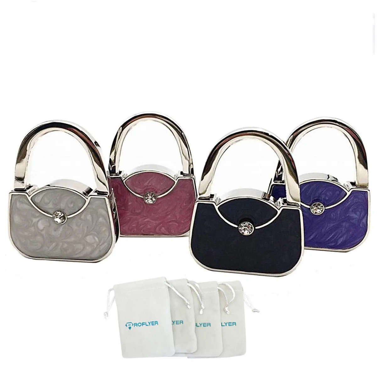 Four small metal handbag-shaped purse hooks with velvet pouches
