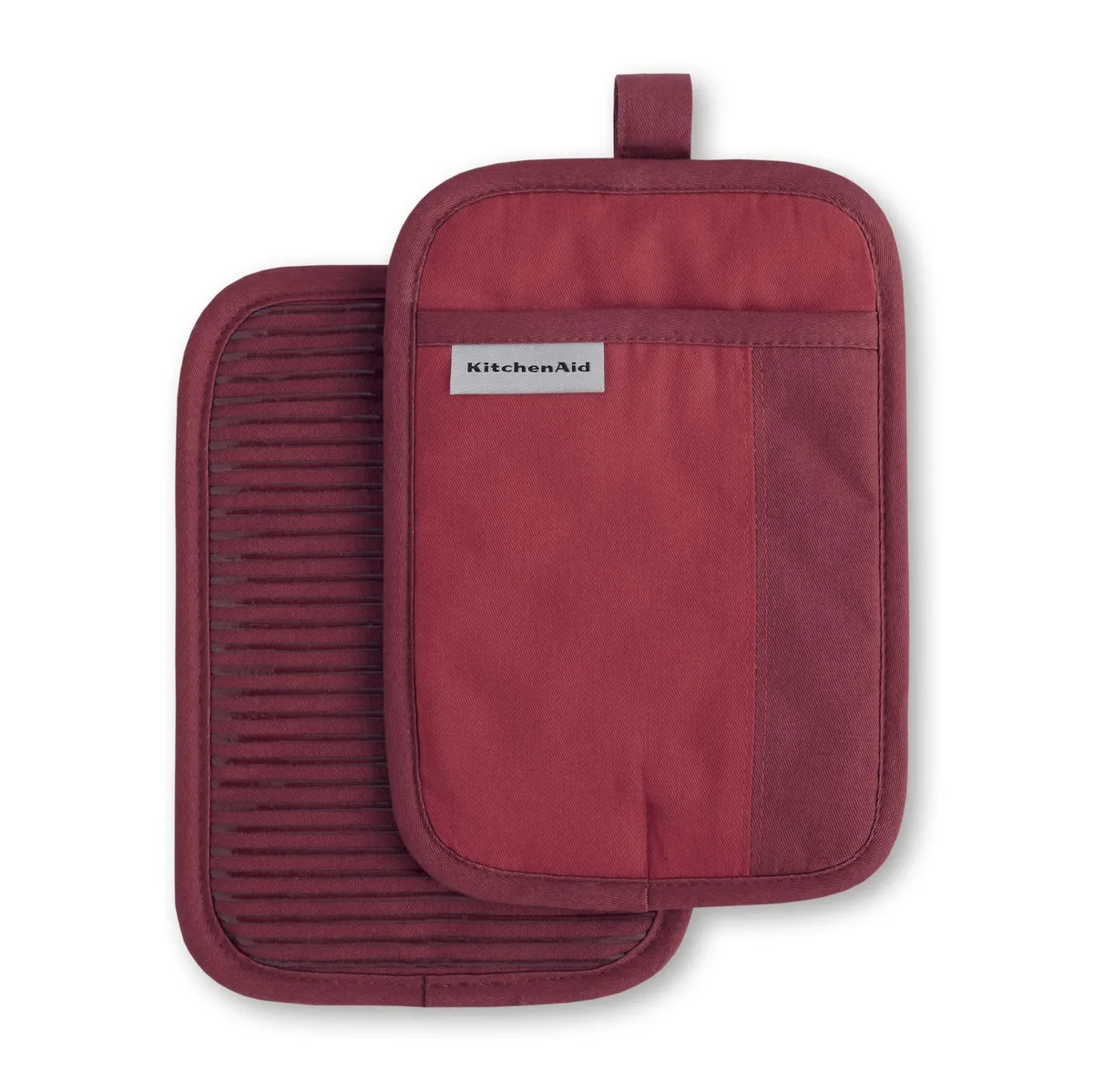 Two rectangular pot holders in red and bordeaux cotton with silicone grip pattern and hanging loops