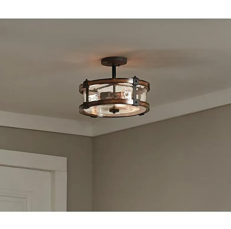 Kichler Barrington 3-light 14-inch distressed black semi-flush mount with wood tone and clear seedy glass drum shade