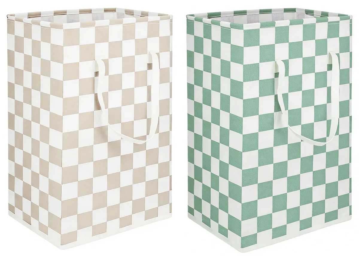 Two black and white checkered fabric laundry hampers with handles, freestanding and collapsible