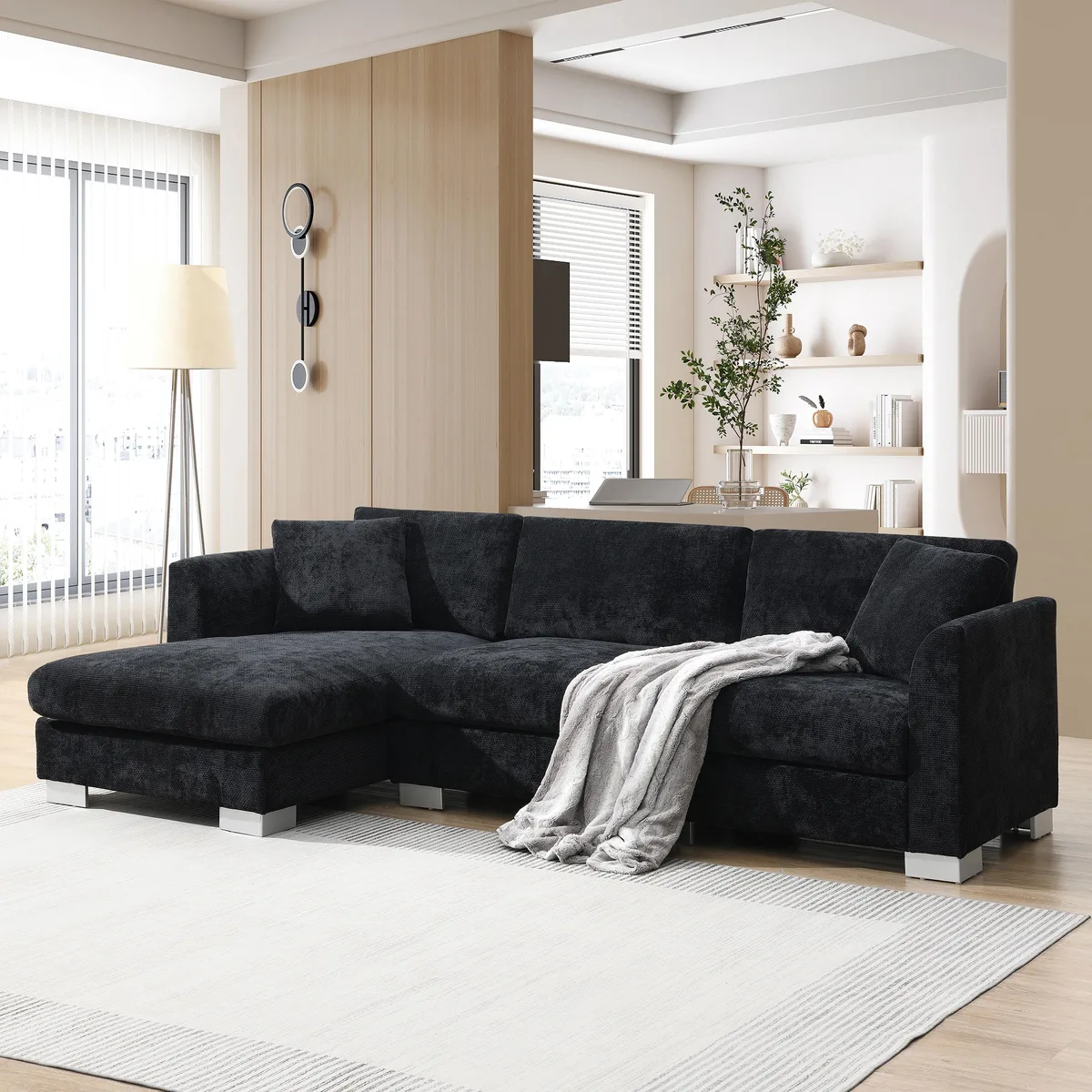 Black chenille L-shaped sectional with oversized chaise and two pillows