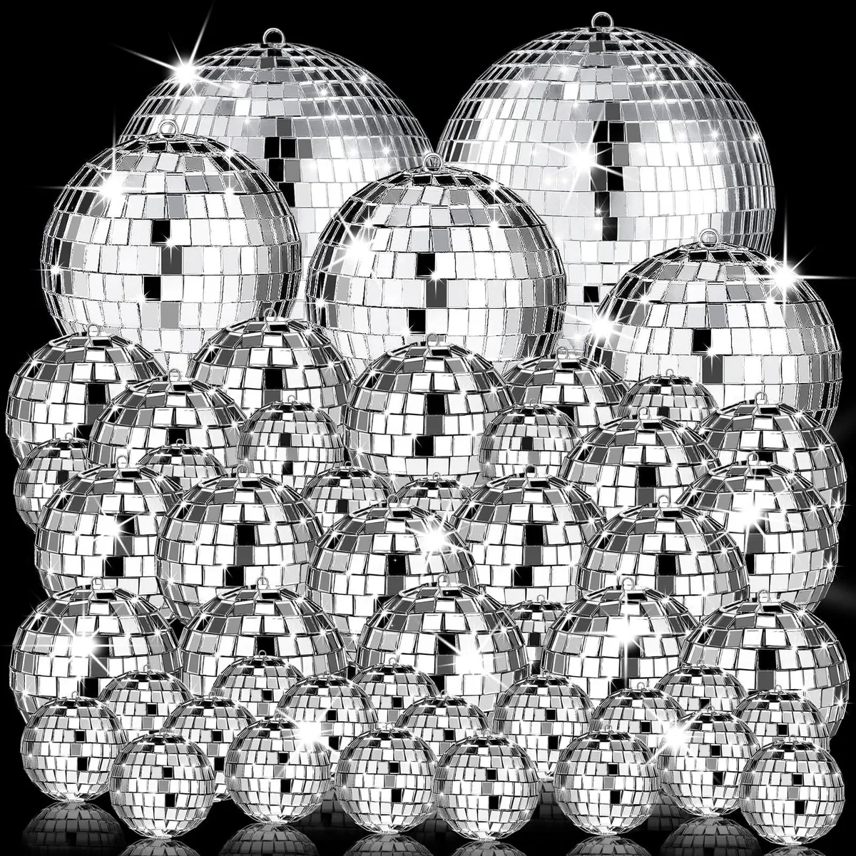 54 small silver mirror balls in sizes from 1.2 to 3.2 inch hanging on strings
