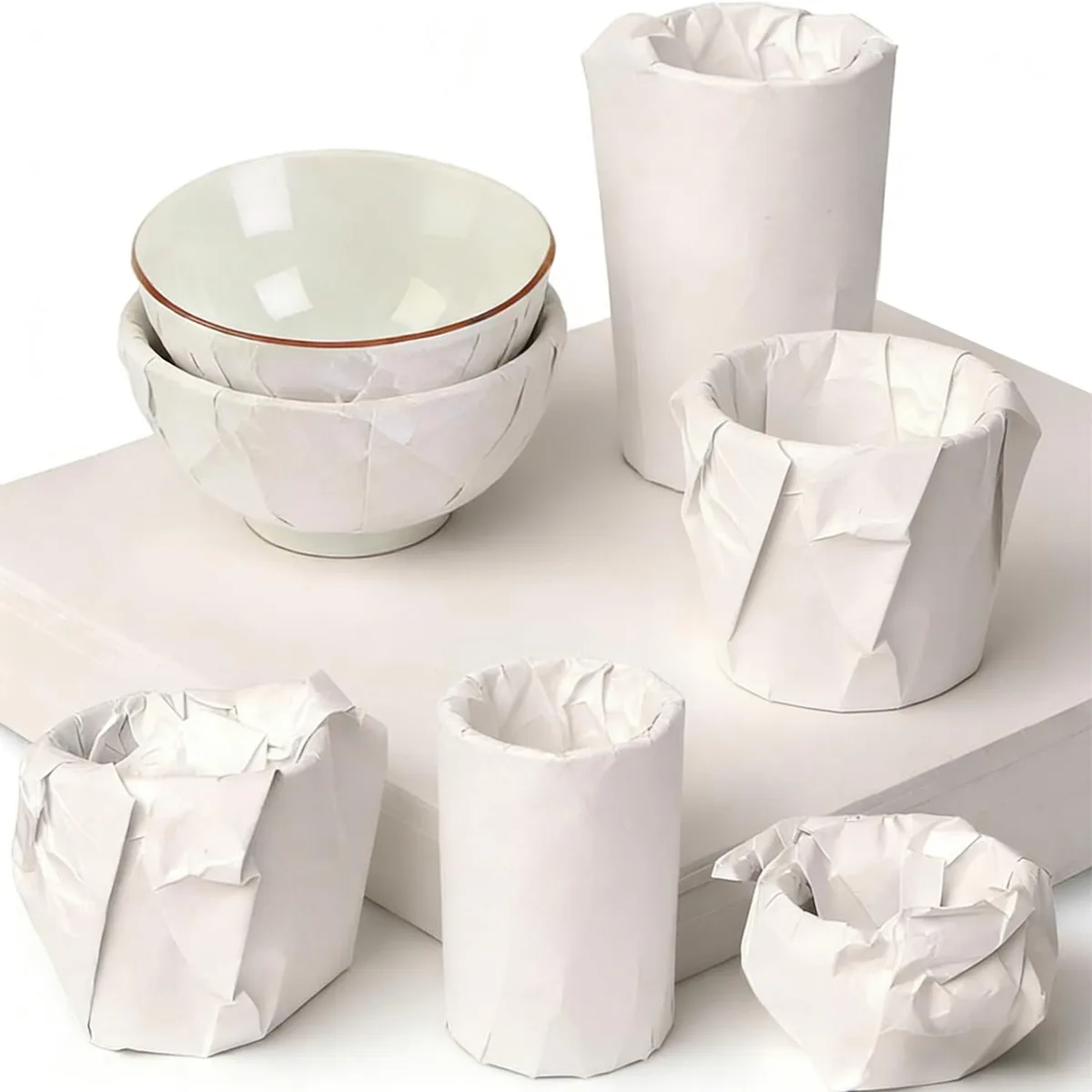 Stack of 102 gray-white paper sheets, 12 by 12 inches