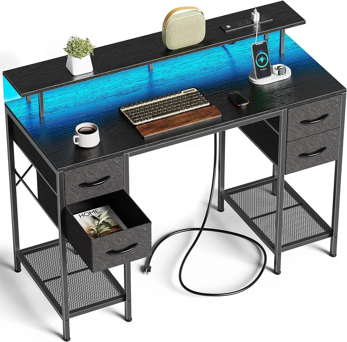 Black rectangular desk with four fabric drawers, monitor riser, LED strip lighting and built-in power outlets