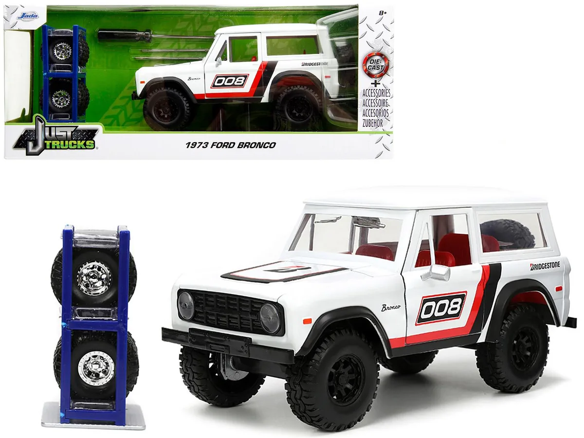 Jada Jada 1973 Ford Bronco #008 White Red Black Interior Extra Wheels 1/24 Diecast — product photo