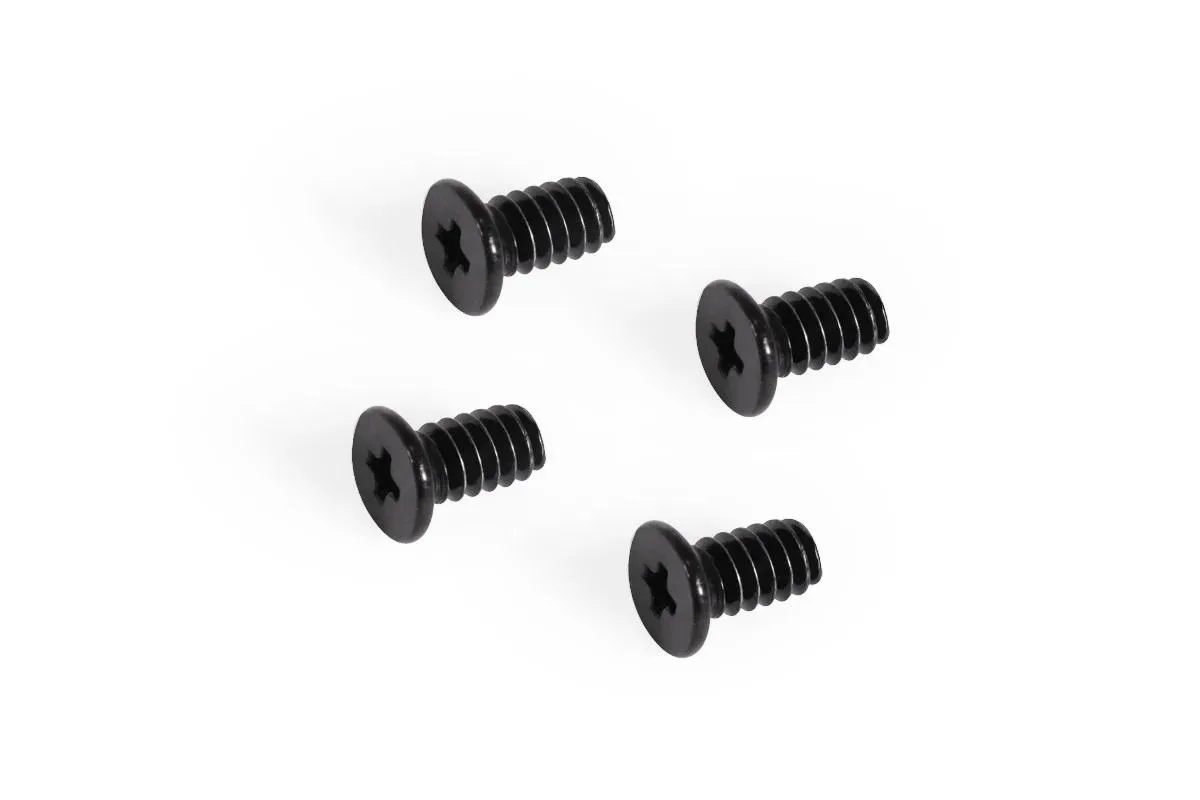 Four black flat-head Phillips screws on a plain background