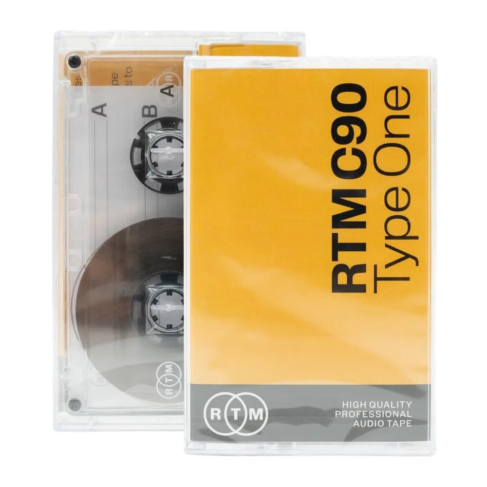Clear plastic rectangular cassette with spools and magnetic tape visible through windows