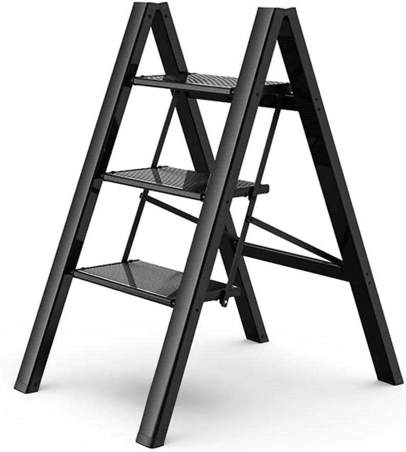 Black aluminium three-step folding ladder with wide anti-slip treads and rubber feet