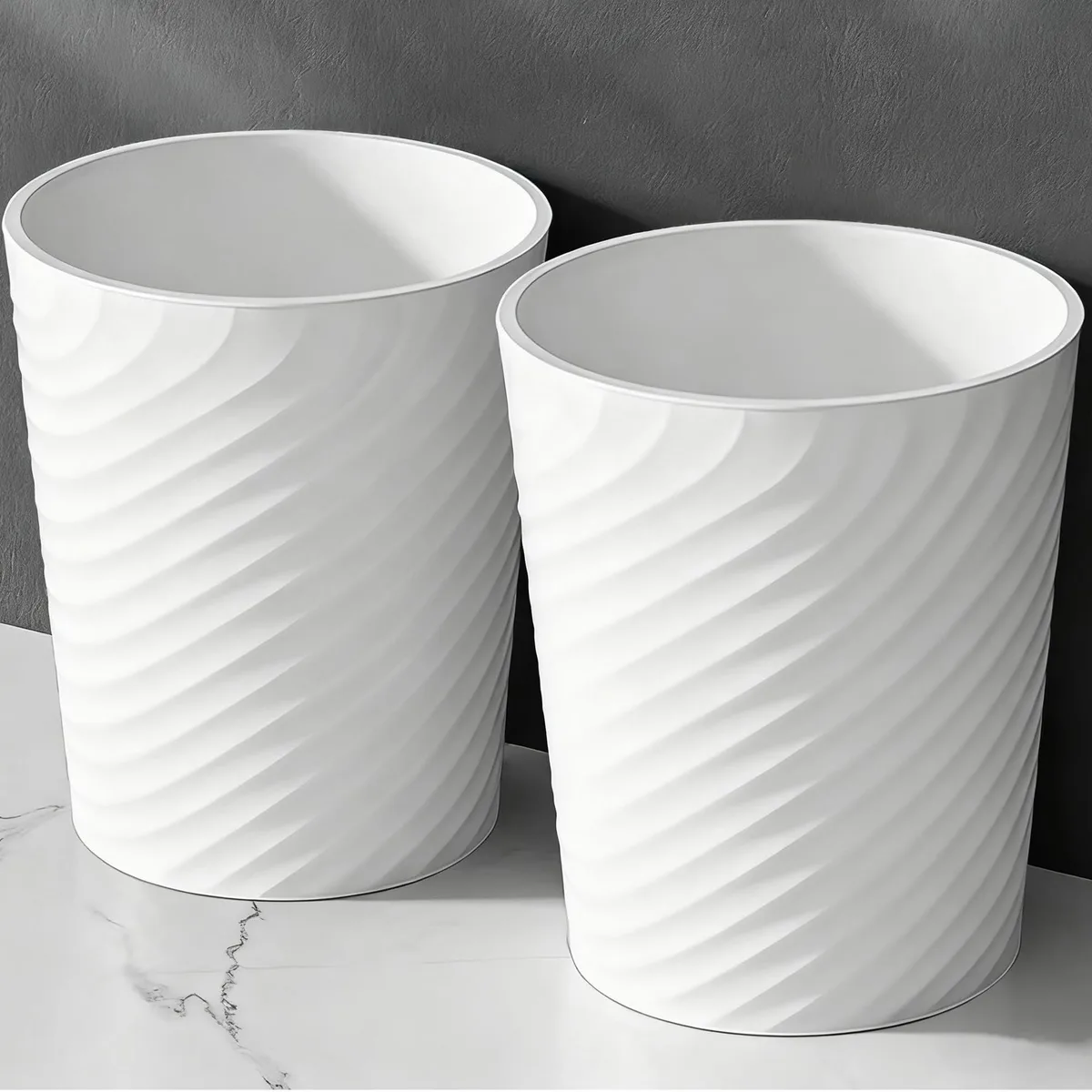 Twelve white cylindrical bins with threaded sides and raised bases