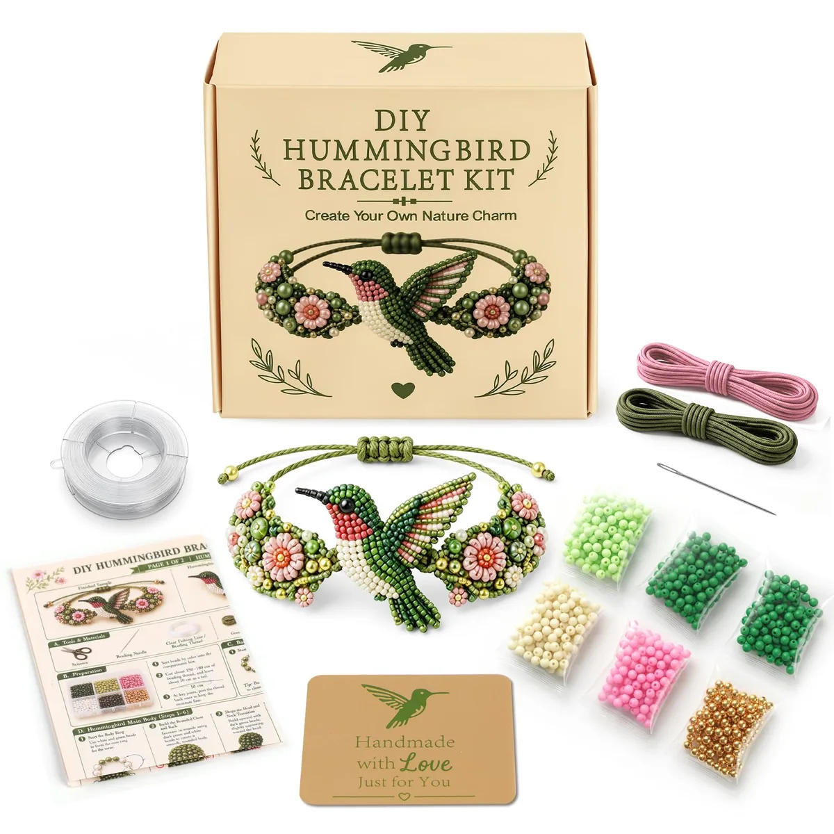 Open kit box showing hummingbird beads, elastic cord, needles, thread and instructions