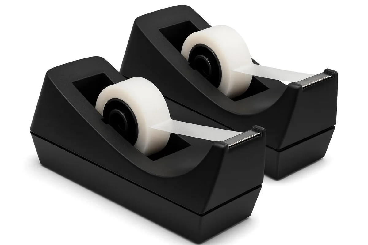 Two black plastic tape dispensers with weighted rubber bases side by side