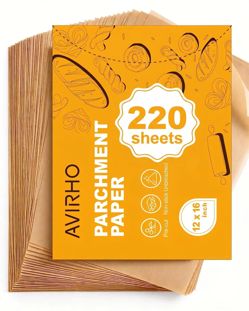 A stack of 220 brown rectangular parchment sheets, each 12 by 16 inches, lying flat
