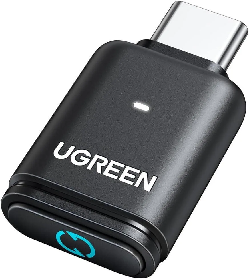 Small black USB-C dongle with matte finish and LED indicator