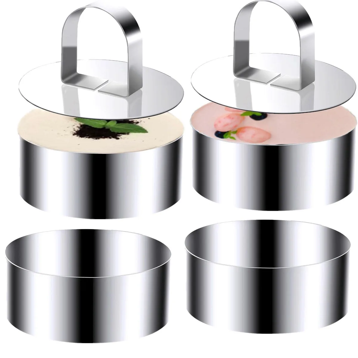 Four stainless steel rings and two pushers on a surface