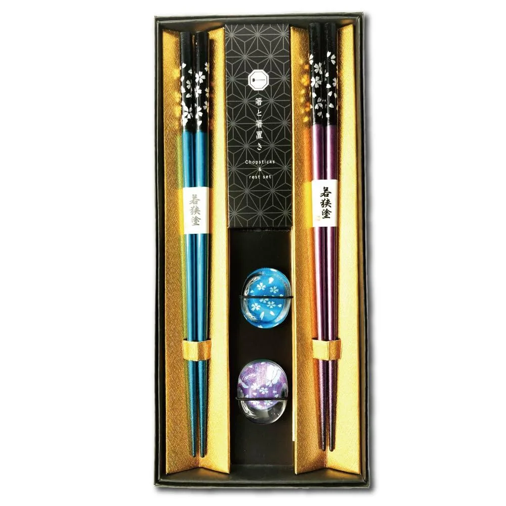 Black lacquered wooden chopsticks with matching rests, seven-piece set in gift box
