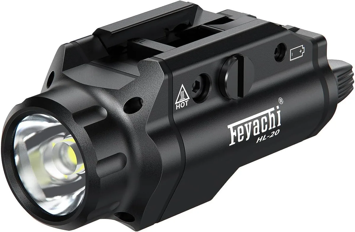Black compact pistol flashlight with rail mount and locating keys