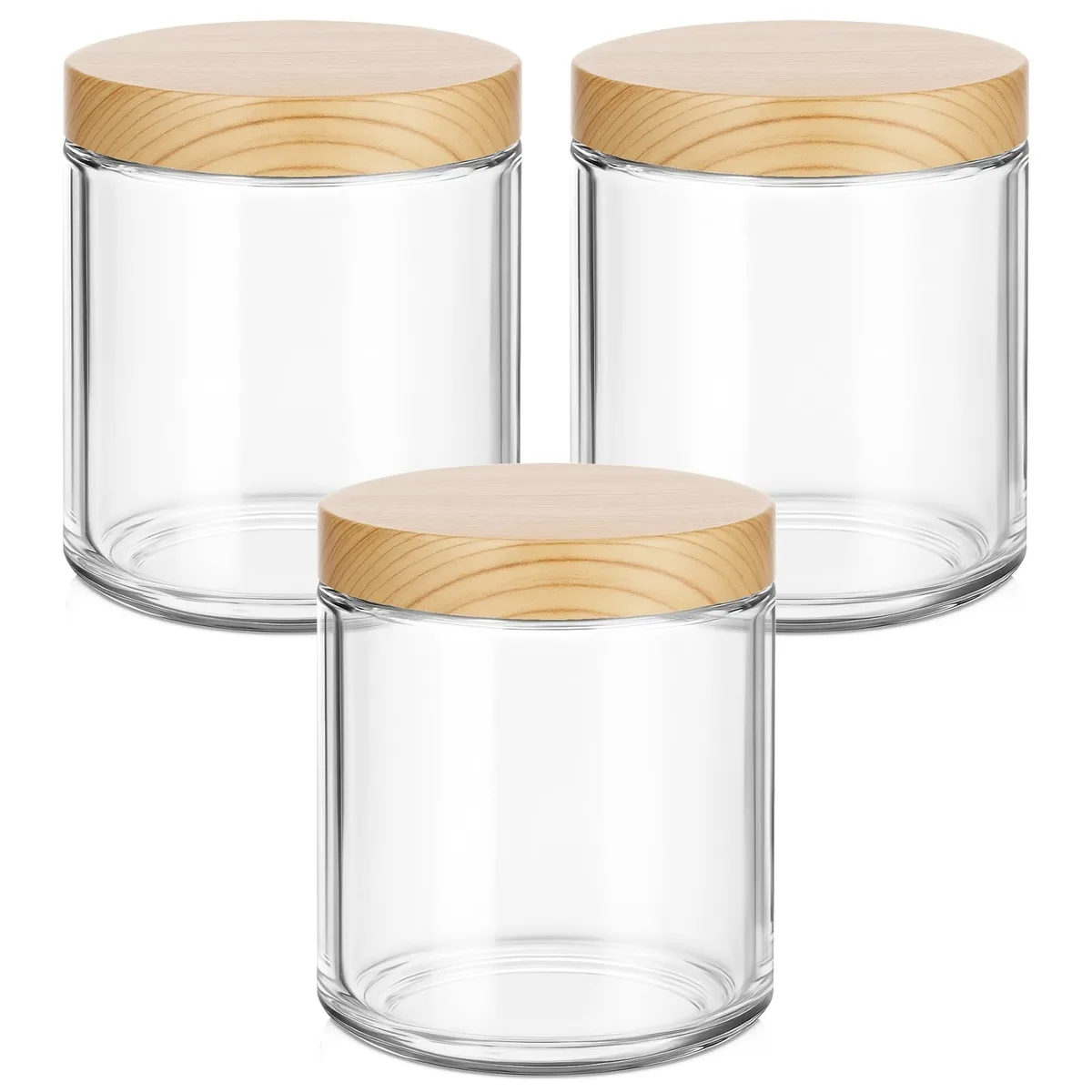 Three clear glass jars with woodgrain lids and labels