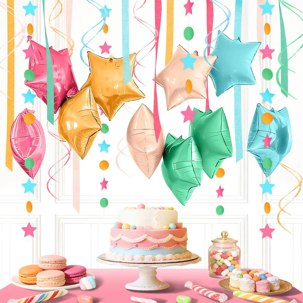 Boxed kit of 27 candy-themed balloons, swirls, crepe rolls and star garlands in assorted pink hues