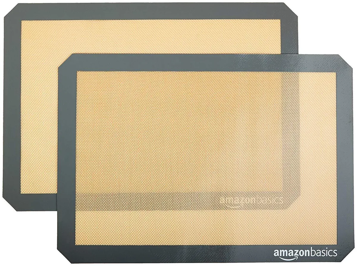 Two rectangular beige and grey silicone baking mats, 16.5 by 11.6 inches each