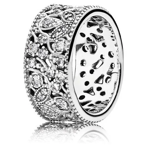 Wide sterling silver ring with winding branches and leaves set with cubic zirconia
