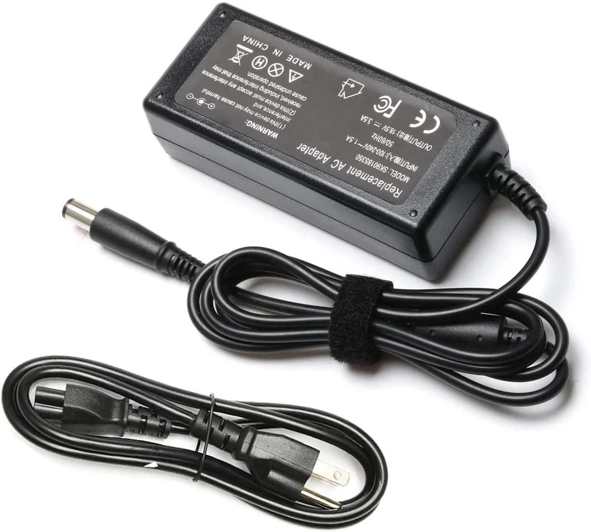 Compact black rectangular AC adapter with a 5.0 by 7.4 mm DC plug and smart-pin