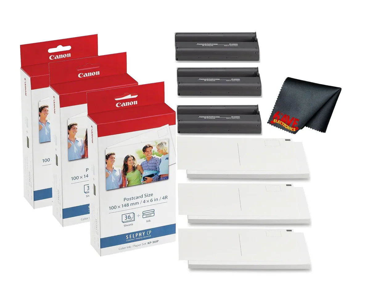 Three sealed boxes of 4x6 inch glossy photo paper with ink cartridges and a microfiber cloth