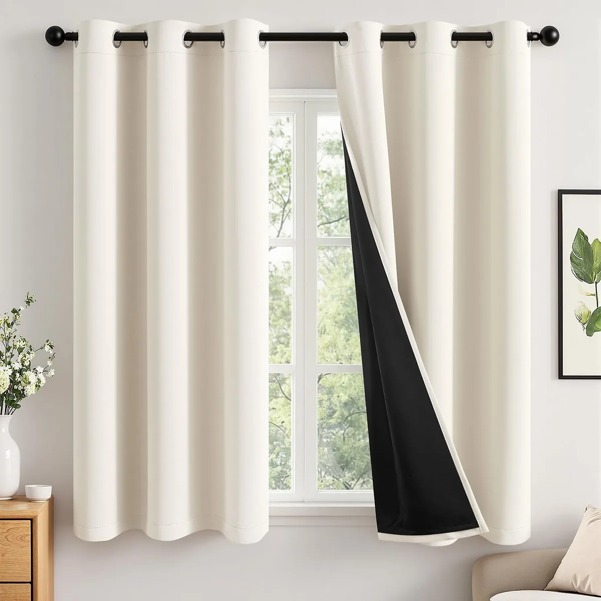 Two cream polyester curtain panels with silver grommets, 40 by 63 inches each