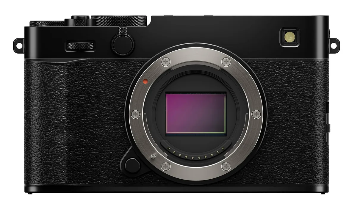 Black compact mirrorless camera body with dials and tilting screen
