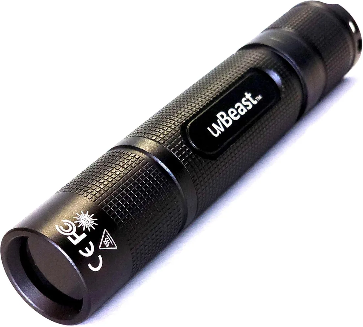 Compact black UV flashlight with textured grip, pocket clip and charging port