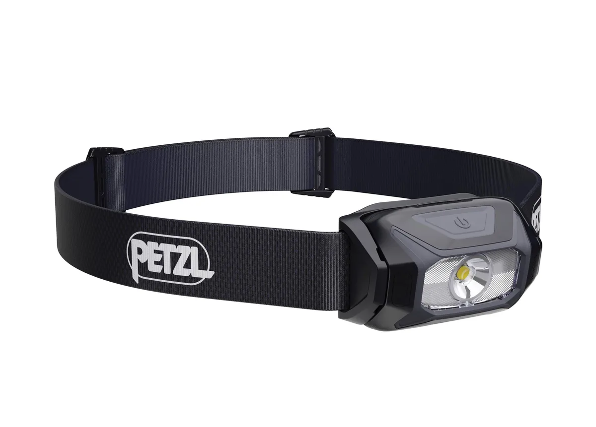 Compact black headlamp with adjustable recycled headband, single button and tilting lamp unit