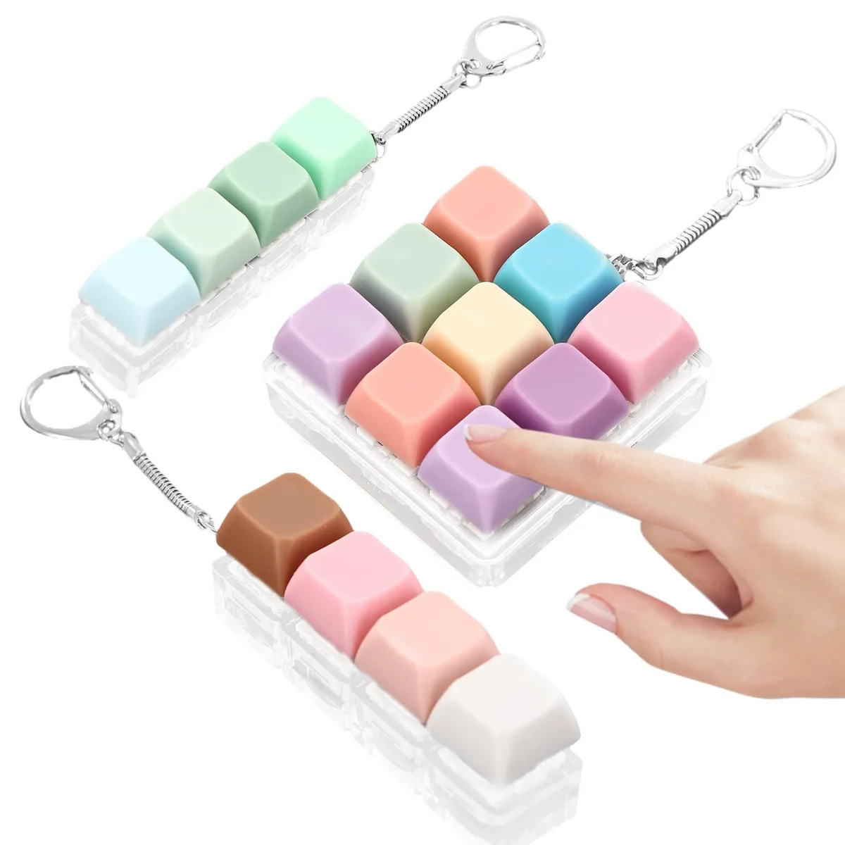 Three plastic keyboard fidget toys: two 4-key and one 9-key, with keychains