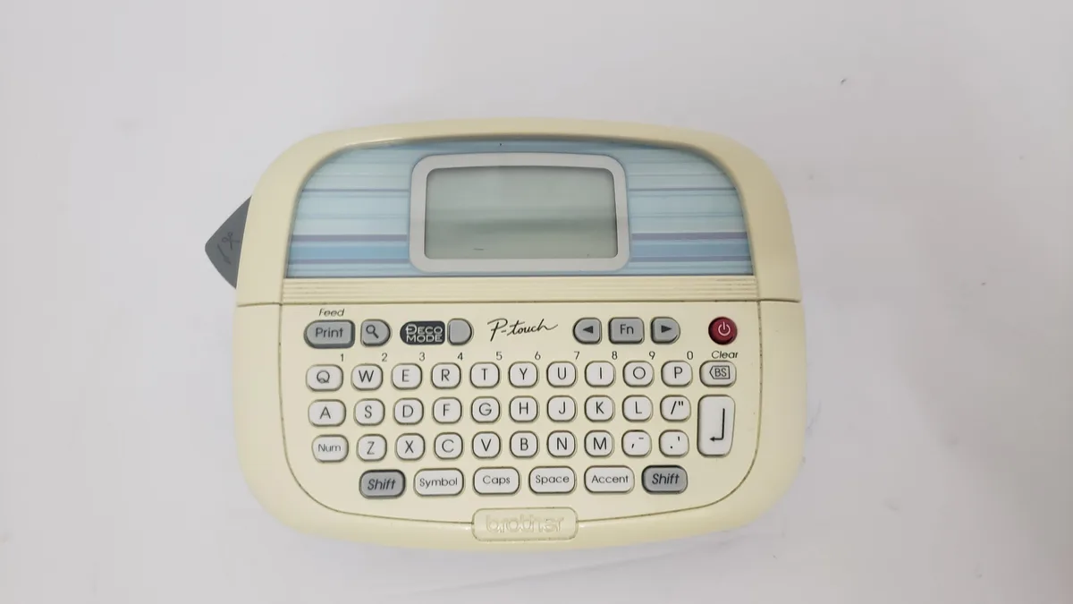 White handheld label printer with QWERTY keyboard and small display