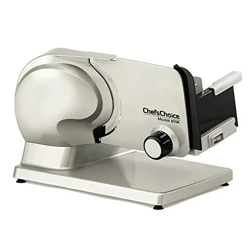 Silver electric meat slicer with 7 inch serrated blade and tilted carriage