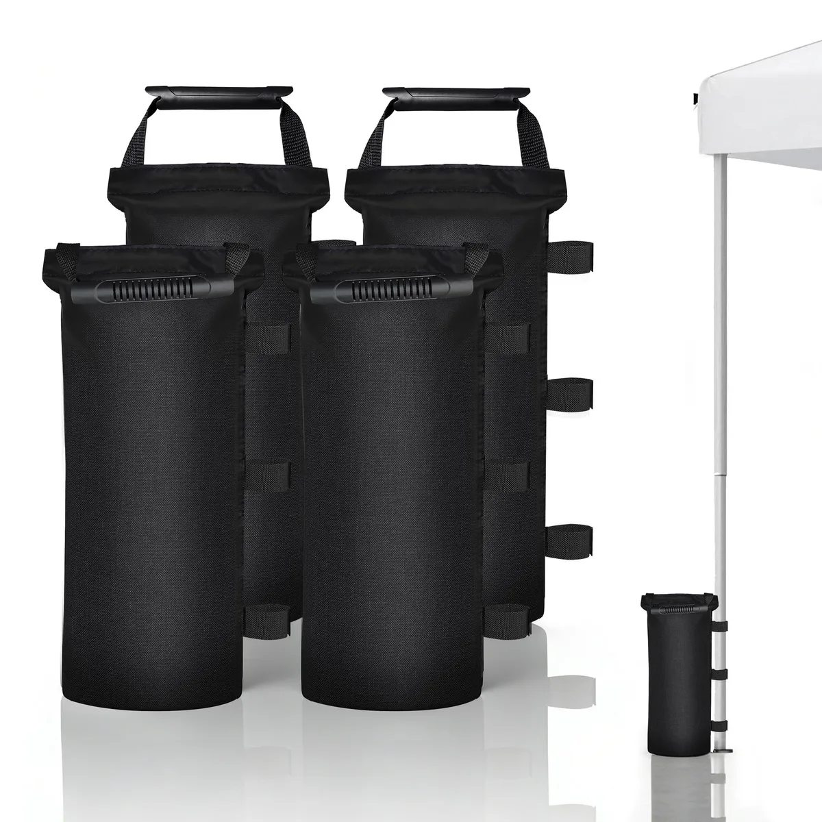 Four black cylindrical fabric sand bags stacked together