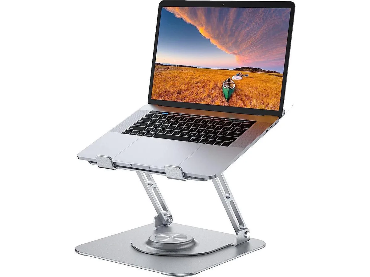 Silver aluminum foldable laptop stand with rotating base and silicone pads