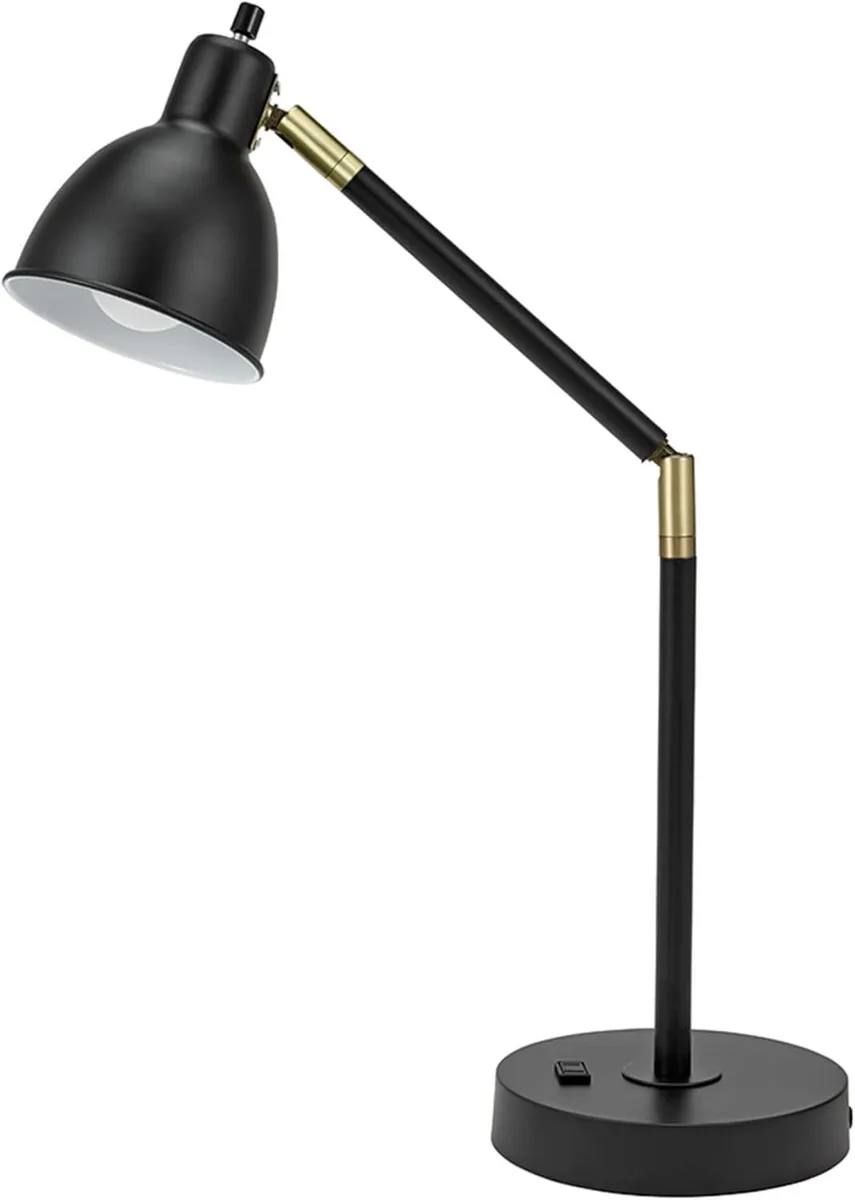 Black metal floor lamp with brass accents, adjustable arm, outlet on base, 20.75 inches tall