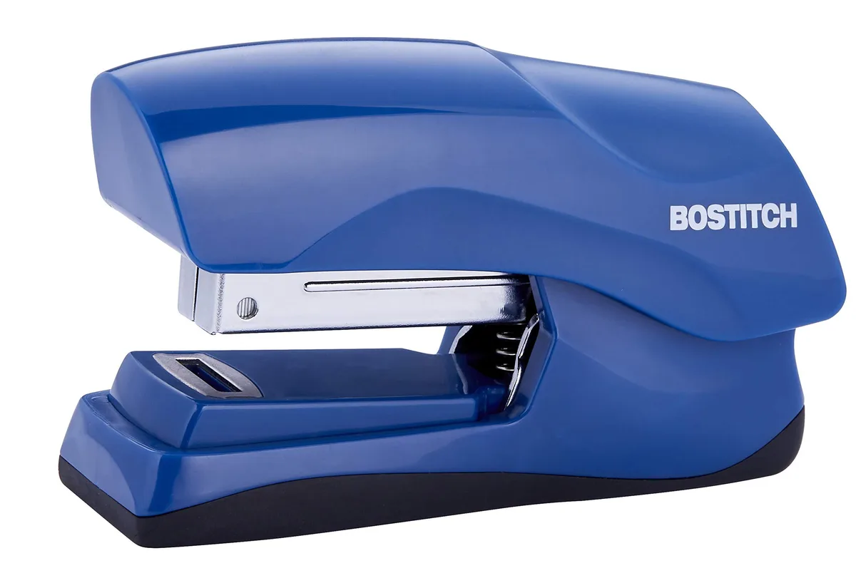 Navy blue compact stapler with rubber base, palm sized