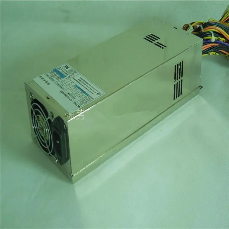 Silver 2U ATX power supply unit with rear fan grille and modular cable sockets