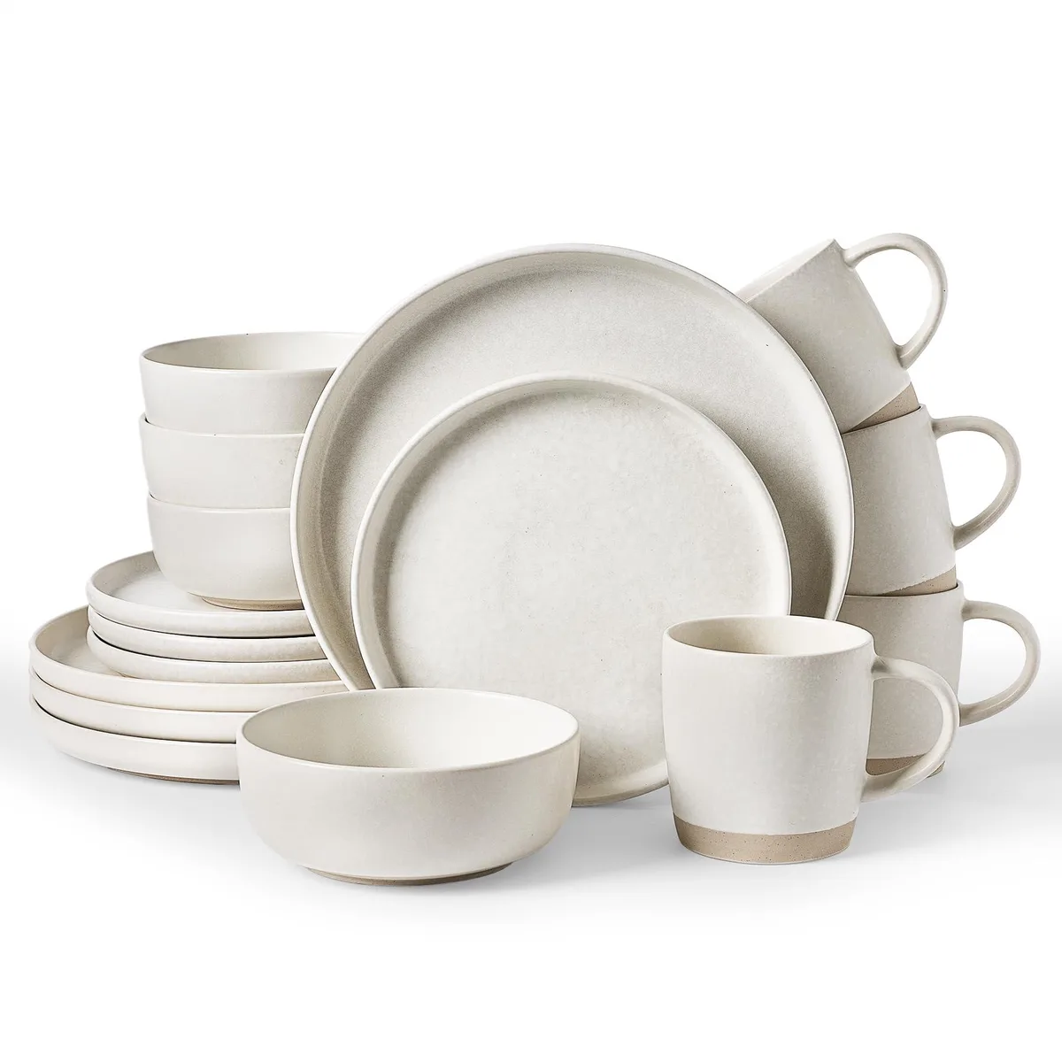 Sixteen matte beige-white stoneware pieces stacked on a table