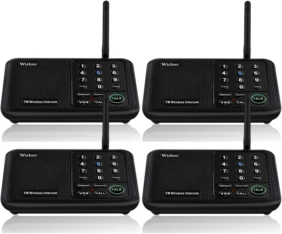 Four black rectangular intercom units with front-facing speaker grilles and buttons