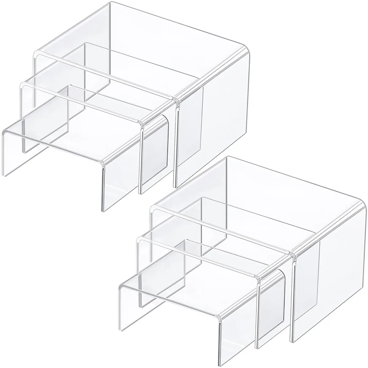Six clear square acrylic risers in three graduated sizes, matte finish, protective film visible