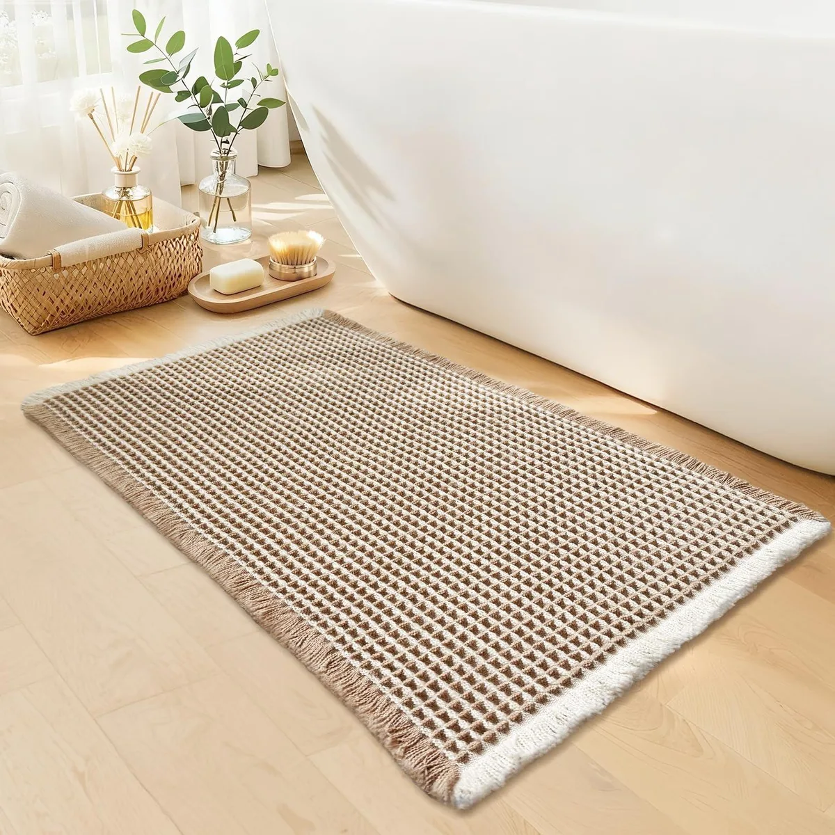 Rectangular khaki and white waffle-textured bath mat with non-slip backing, 18 by 30 inches