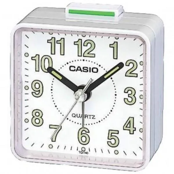 White round travel alarm clock with analog face and resin case