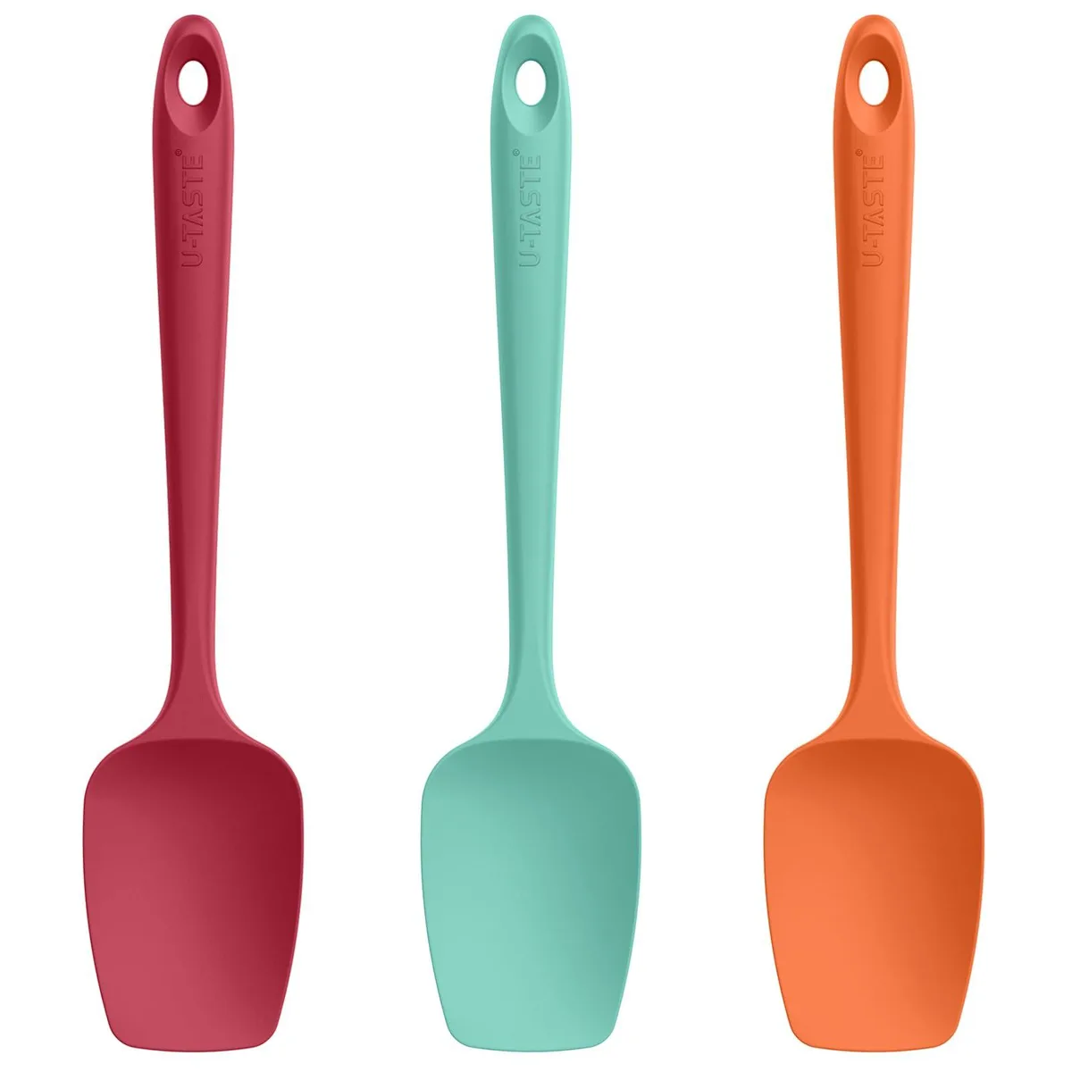 Three colourful silicone spoon spatulas with thin flexible heads and non-slip handles